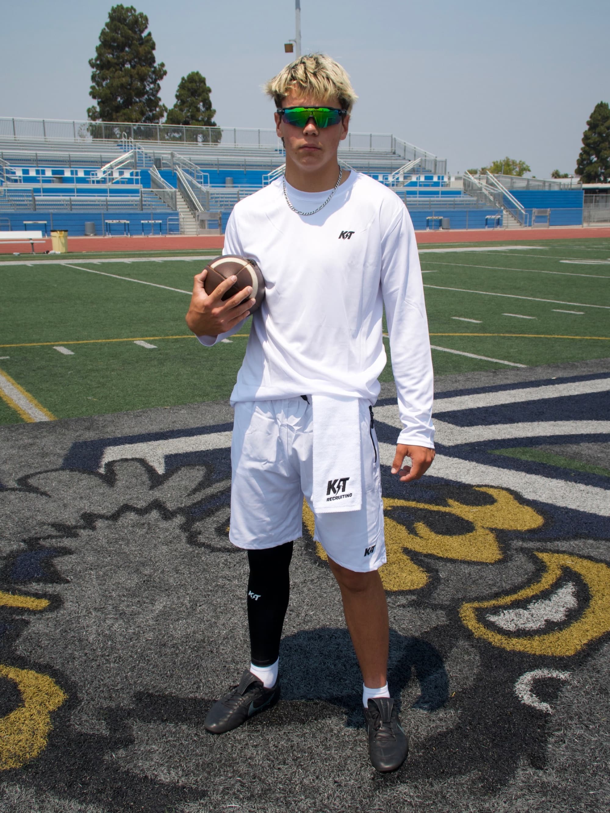 A KT athlete in full KT gear at midfield
